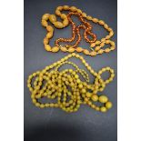 Three strings of butterscotch amber style beads, 168g; together with another toffee amber style