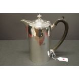 A George III silver hot water jug, marks indistinct, by Robert Garrard?, London 1816, 21cm, 571g all
