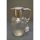 A silver mounted glass claret jug, by John Grinsell & Sons, Birmingham 1915, 20.5cm.