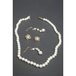 A string of cultured pearls having 9ct gold clasp; together with two pairs of unmarked pearl