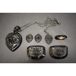 A large Victorian carved jet heart pendant and matching earrings; together with a French jet