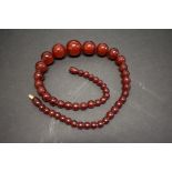 A string of cherry amber style beads, 45cm, 34.5g