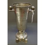 A silver twin handled Cricket trophy cup, by Walker & Hall,  Sheffield 1936, 21.5cm; together with