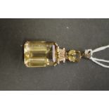 A large rectangular citrine pendant with smaller citrine above, having unmarked swivel mount, 20mm x