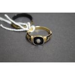 An 18ct gold and black enamel memento mori ring set small diamond; together with a black and gold