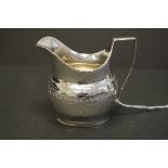 A George III silver cream jug, makers mark rubbed, London 1805, 10cm, 96g.
