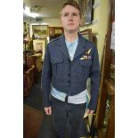 An RAF jacket, with cloth Signaller's badge and six medal ribbons.