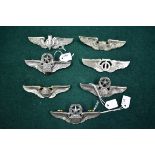 A group of seven US Airforce wings of various ranks, to include; Command Navigator; Bombardier by