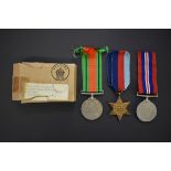 Medals: a World War II group of three, comprising 1939-45 Star; War medal; and Defence medal;
