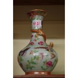 A Chinese famille rose celadon ground baluster vase, decorated in relief with a lingzhi dragon, 20.