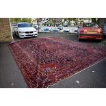 A fine and extremely large Bakhtiari carpet, having three central floral medallions on a floral