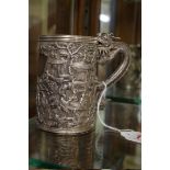 A Chinese silver tankard, with dragon handle and relief decoration, 167g, 9.5cm.