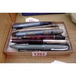 A collection of fountain pens and similar, to include five with 14ct nibs; and a silver propelling