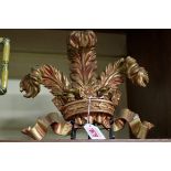 A carved gilt wood Prince of Wales feathers, 22cm high.