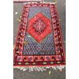 A Persian style rug, having floral geometric design, 198 x 104cm.