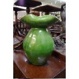 A large green glazed vase, possible Farnham Pottery, with tricorn rim, 54cm high.