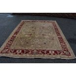 A Pakistani rug, having allover floral central field on cream ground, with floral border on a