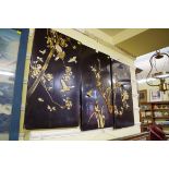 Three Japanese black lacquer and shibyama panels, largest 75.5 x 42cm.