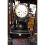 An ebonized mantel clock, with enamel dial inscribed 'Rollin, a Paris', 44.5cm high, with pendulum.