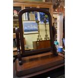 A Victorian mahogany toilet mirror, 54cm wide.