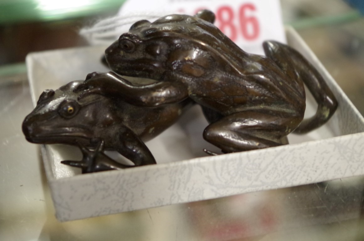 A Japanese bronze figure group of two toads, probably Meiji period, signed, 7.5cm wide, (s.d.)
