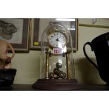 A German brass Anniversary clock, with brass dome.