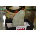 A Chinese carved celadon jade figure group, 5.8cm, high.