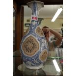 A Vietnamese blue and white vase, Le dynasty, 15th century, with pierced roundels, 29cm high.