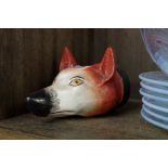 A 19th century pottery novelty fox head stirrup cup, 13cm.