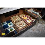 A collection of Victorian pottery tiles.