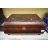 A Japanese red lacquer work box, 39.5cm wide.