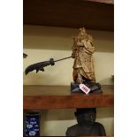 A Japanese carved and stained wood figure of a Samurai warrior, on wood base, total height 27.5cm.