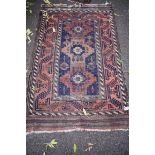 A Persian rug, having allover geometric design, together with a similar rug having floral design,