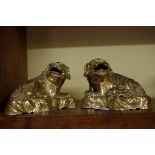A pair of Chinese polished bronze lion dogs, each on conforming stand, 20cm wide.