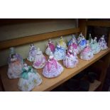 Eighteen small Coalport porcelain figures.