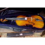 An antique Continental violin, with single piece 14in back, with bow and padded case.