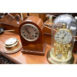 An Edwardian mahogany and inlaid dome top mantel clock, 27cm high; together with a brass anniversary