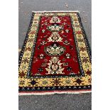 A Persian style rug, having five central floral medallions with floral and geometric border, 200 x