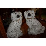 A large pair of Victorian Staffordshire pottery spaniels, 34cm high.