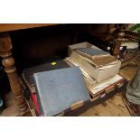 A collection of photograph albums and related ephemera.