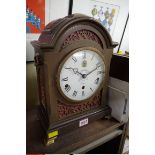 A reproduction mahogany musical mantel clock, by Elliott for Garrard & Co, with certification, 37.