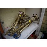 A set of three neo classical style cast brass twin branch wall lights.