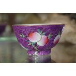 A small Chinese purple ground peach bowl, 'Shen de Tang' mark to base, 6.4cm diameter.