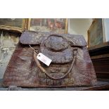 A vintage crocodile skin handbag.