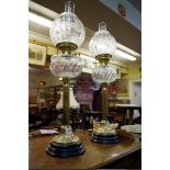 A pair of Victorian style brass oil lamps.