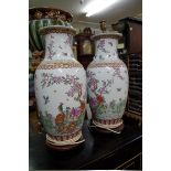 A pair of Chinese famille rose table lamps, height including fitting 57cm.