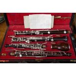 An F Loree African blackwood oboe, serial number U75, with open hole conservatoire system silver