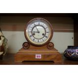 A walnut mantel clock, 26.5cm high.