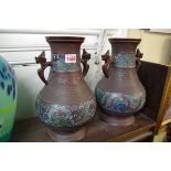 A pair of Chinese bronze cloisonne enamel twin handled vases, 30cm high.