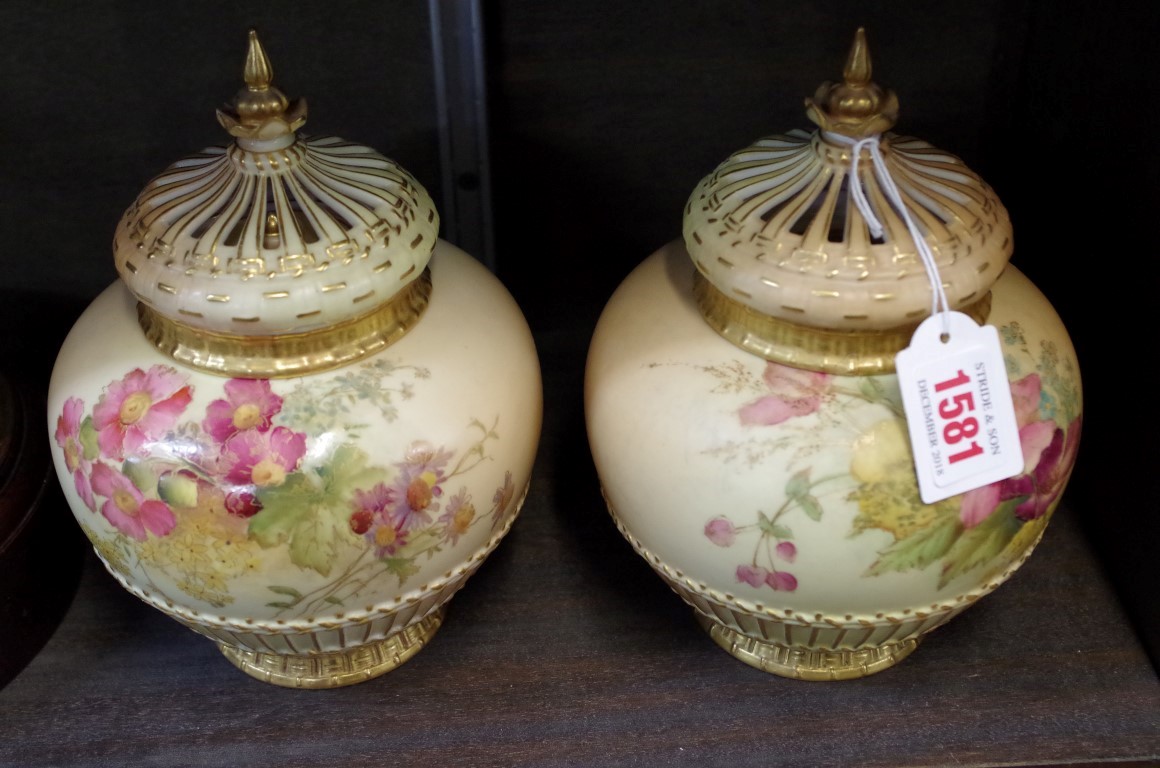 A pair of Royal Worcester blush ivory pot-pourri vases and covers, one with internal cover, one